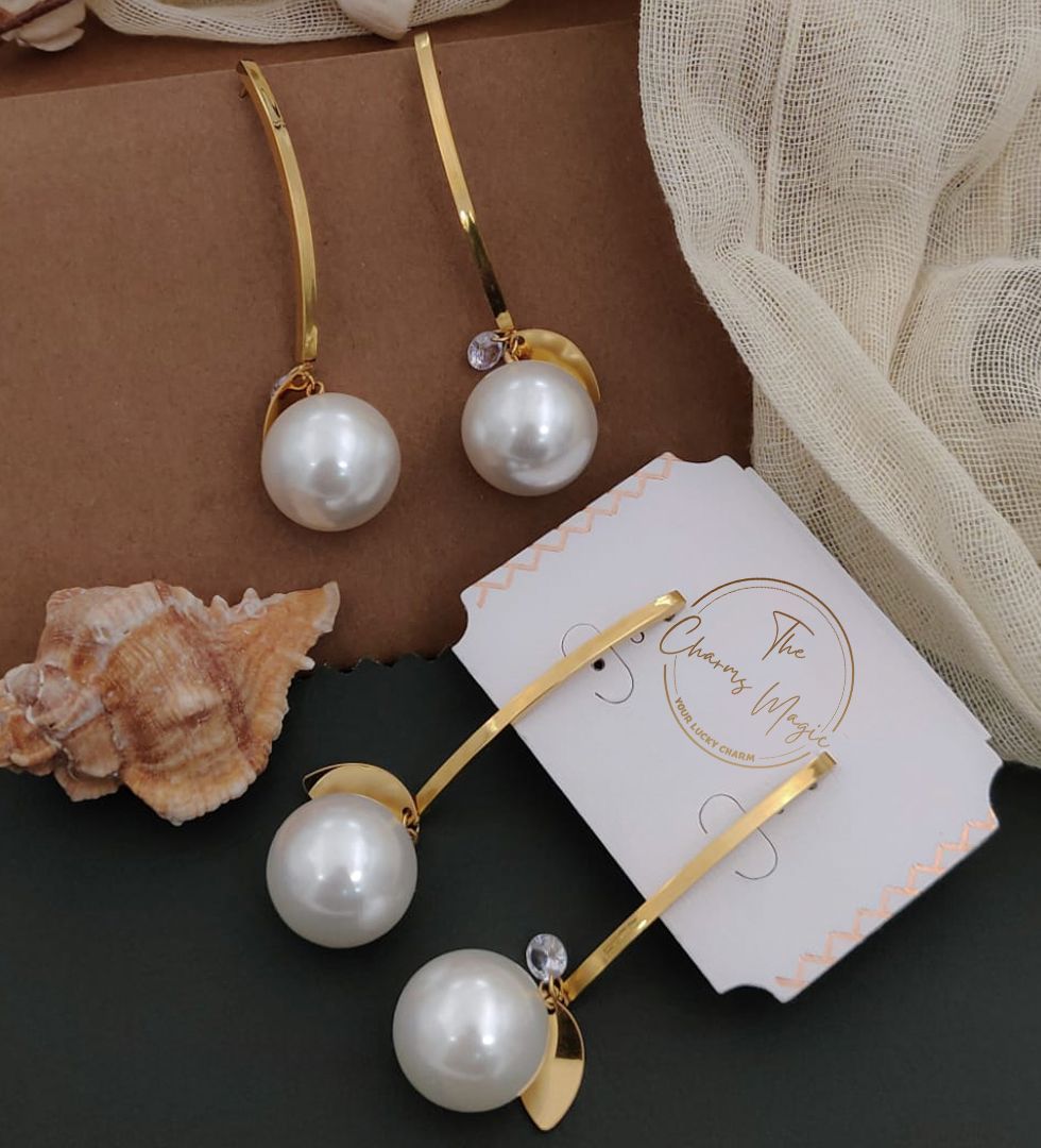 Exquisite pearl earrings beautifully complemented by gold-plated accents